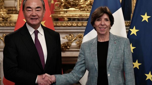 French Foreign Minister Catherine Colonna, right, greets China's top foreign policy official Wang Yi prior to their meeting in Paris France, Wednesday, Feb. 15, 2023.  - Sputnik Africa