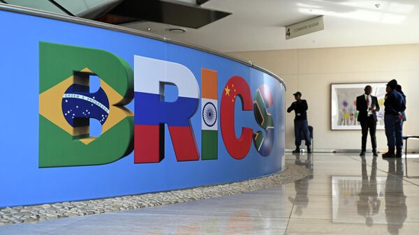 BRICS logo at the information desk of the 15th BRICS summit in Johannesburg, South Africa, August 22-24, 2023.  - Sputnik Africa