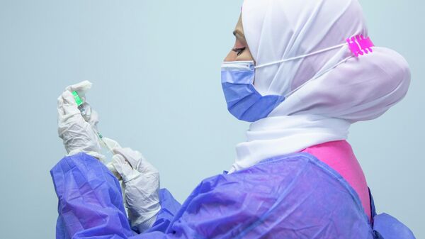 In this March 4, 2021, file photo, a nurse prepares the AstraZeneca COVID-19 vaccine at Al-Nozha Hospital in Cairo, Egypt. - Sputnik Africa