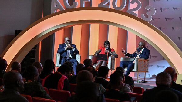Benedict Oramah (L), president and chairman of Afreximban, and Wamkele Mene (L), Secretary General of African Continental Free Trade Area (AfCFTA) attend a panel discussion at the 2023 Africa CEO Forum in Abidjan on June 6, 2023.  - Sputnik Africa