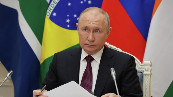 Russian President Vladimir Putin participates via videoconference in the final press conference after the joint meeting of the BRICS leaders with the heads of state and government of the invited countries and multilateral organizations, August 24, 2023 - Sputnik Africa
