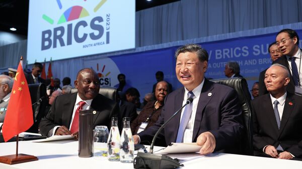 South Africa's President Cyril Ramaphosa, left, and Chinese President Xi Jinping wait before a meeting during the 15th BRICS Summit at the Sandton Convention Center in Johannesburg, South Africa, on August 24, 2023. - Sputnik Africa