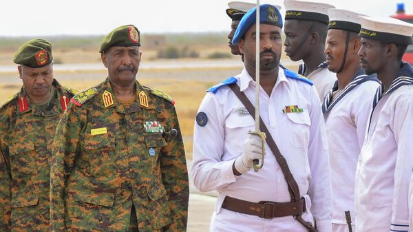 Sudan's Army chief Abdel Fattah al-Burhan (L) arrives to the coastal city of Port Sudan on August 27, 2023.  - Sputnik Africa