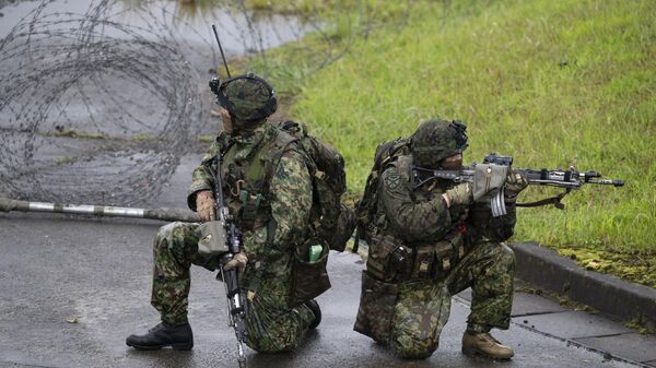 Japan Self-Defense Force soldiers take part in a joint military drill between the Japan Self-Defense Force, the French Army and US Marines at the Kirishima exercise area in Ebino, Miyazaki prefecture on May 15, 2021.  - Sputnik Africa