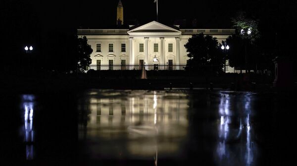 The White House is seen on a rainy night in Washington, Wednesday, June 30, 2021. President Joe Biden will hold a naturalization ceremony Friday at the White House in which 21 immigrants will become citizens. - Sputnik Africa