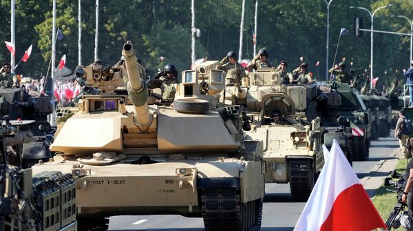 US-made Abrams tanks purchased by Poland take part in a massive military parade to celebrate the Polish Army Day in Warsaw. August 15, 2023. - Sputnik Africa