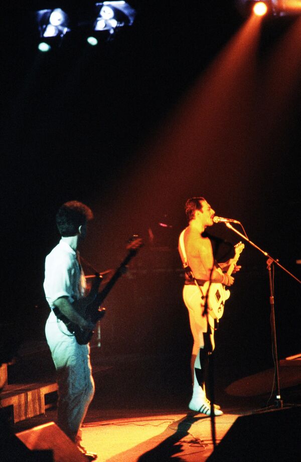 A file picture taken on September 18, 1984 showing Rock star Freddie Mercury (R), lead singer of the rock group &quot;Queen&quot;, and bass player John Deacon (L) during a concert at the Palais Omnisports de Paris Bercy (POPB).  - Sputnik Africa