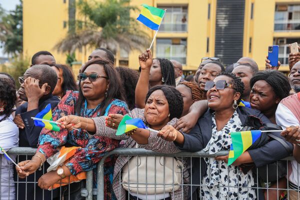 People holding Gabonese flags attend the swearing-in ceremony of Gabon&#x27;s new strongman Brice Oligui Nguema in Libreville on September 4.  - Sputnik Africa