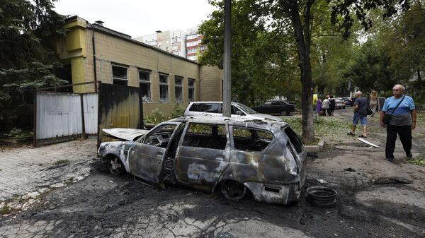A car that burned down as a result of shelling by the Armed Forces of Ukraine in the Kievsky district of Donetsk. - Sputnik Afrique