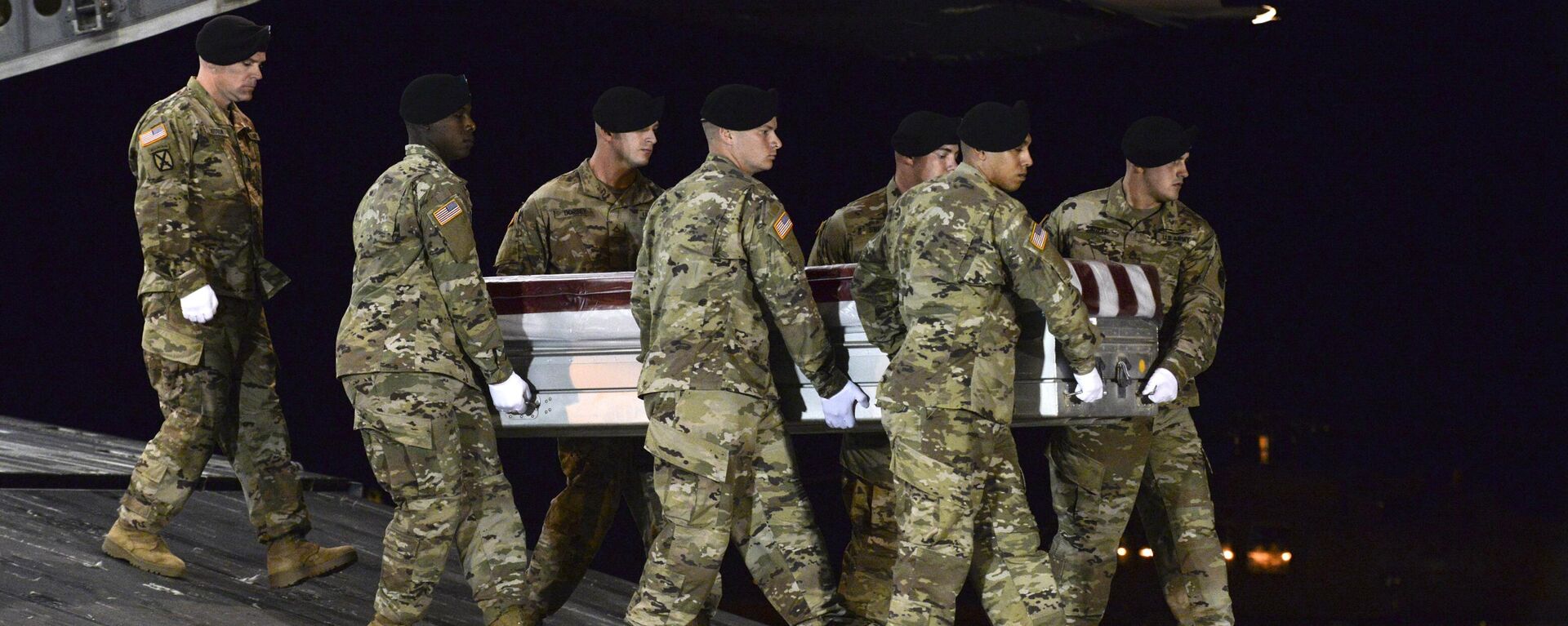In this Oct. 5, 2017 file photo provided by the U.S. Air Force, a U.S. Army carry team transfers the remains of Army Staff Sgt. Dustin Wright of Lyons, Ga., upon arrival at Dover Air Force Base, Del. Wright was one of four U.S. troops and four Niger forces killed in an ambush by dozens of Islamic extremists on a joint patrol of American and Niger Force. U.S. President Donald Trump’s approach to Africa in his first year in office has been one largely of neglect - and then suddenly one of shocking insult. The killings of the four U.S. soldiers in the West African nation of Niger set off outrage, along with questions about why the U.S. military was there at all - Sputnik Africa, 1920, 08.09.2023