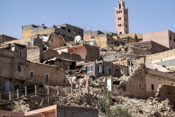 The minaret of a mosque stands behind damaged or destroyed houses following an earthquake in Moulay Brahim, Al-Haouz province, on September 9, 2023. Morocco&#x27;s deadliest earthquake in decades has killed at least 1000 people, officials said on September 9, causing widespread damage and sending terrified residents and tourists scrambling to safety in the middle of the night.  - Sputnik Africa