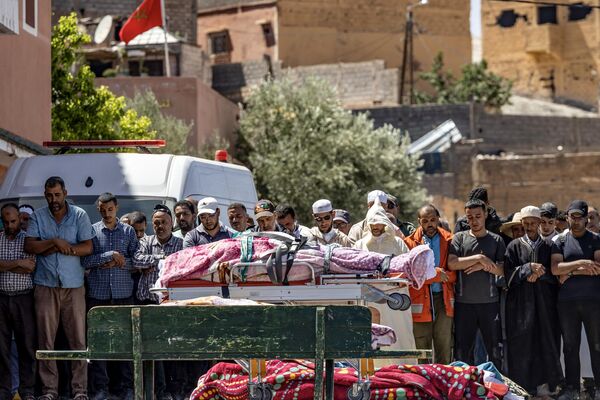 People recite a prayer in front of the bodies of victims killed in an earthquake in Moulay Brahim, Al Haouz province, on September 9, 2023. Morocco&#x27;s deadliest earthquake in decades has killed at least 1000 people, officials said on September 9, causing widespread damage and sending terrified residents and tourists scrambling to safety in the middle of the night.  - Sputnik Africa