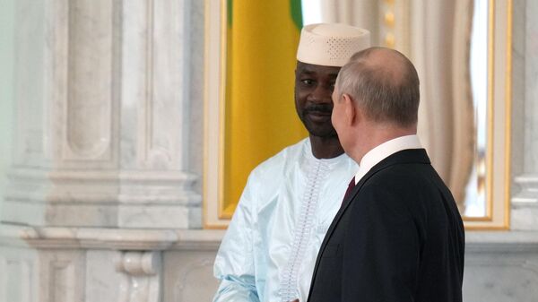 Russian President Vladimir Putin, left, and Mali's interim President Assimi Goita shake hands during their meeting in Moscow, Russia, on July 29, 2023. - Sputnik Africa