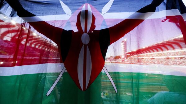 A fan of Kenya holds up a national flag during the final in the women's 5000-meter run at the World Athletics Championships on July 23, 2022, in Eugene, Ore.  - Sputnik Africa