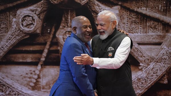 Indian Prime Minister Narendra Modi, right, shares a light moment with African Union Chairman and President of the Union of the Comoros Azali Assoumani upon his arrival at Bharat Mandapam convention centre for the G20 Summit in New Delhi, India, Saturday, Sept. 9, 2023. - Sputnik Africa