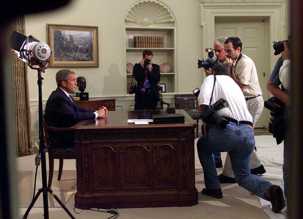 President Bush is seen through the windows of the Oval Office of the White House in Washington, Tuesday, Sept. 11, 2001, as he addresses the nation about terrorist attacks at the World Trade Center and the Pentagon.  - Sputnik Africa