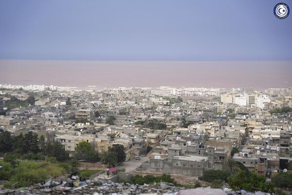 Muddied seawaters caused by heavy flooding are visible off the coast of the city of Derna. - Sputnik Africa