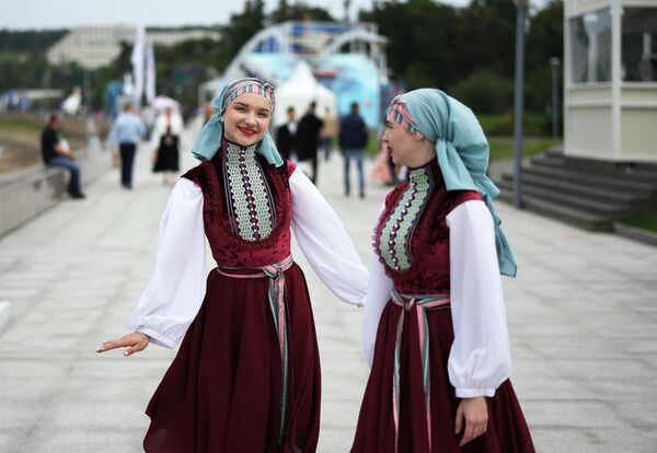 Girls proudly donning their national costumes at the EEF 2023. - Sputnik Africa