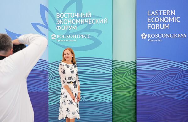 A young lady posing for a photo at the Eastern Economic Forum in Vladivostok. - Sputnik Africa
