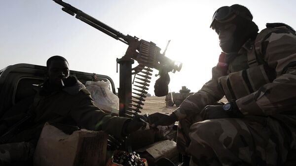 Malian soldiers sit aboard a vehicle as they near Bourem, northern Mali. - Sputnik Africa
