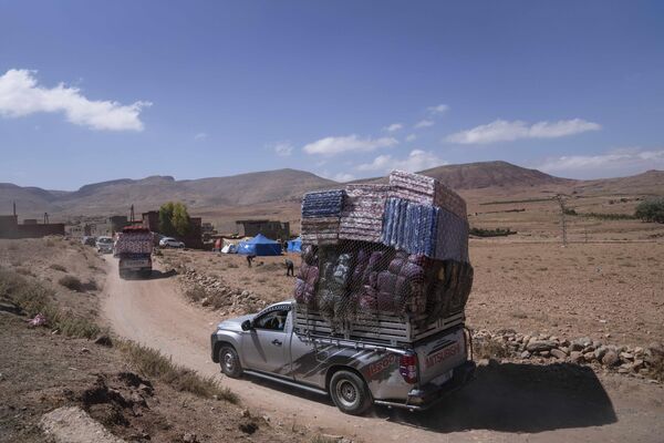 Trucks carrying humanitarian aid drive through a remote village which was affected by the earthquake, in the town of Douzrou, outside Marrakech, Morocco, Wednesday, Sept. 13, 2023. - Sputnik Africa
