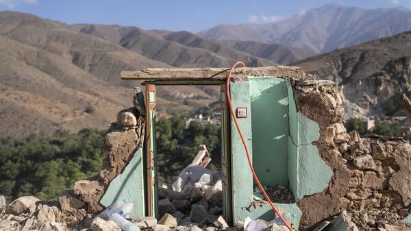 The door of what used to be a house stands amid earthquake rubble in the town of Imi Ntala, near Marrakech, Morocco. - Sputnik Africa