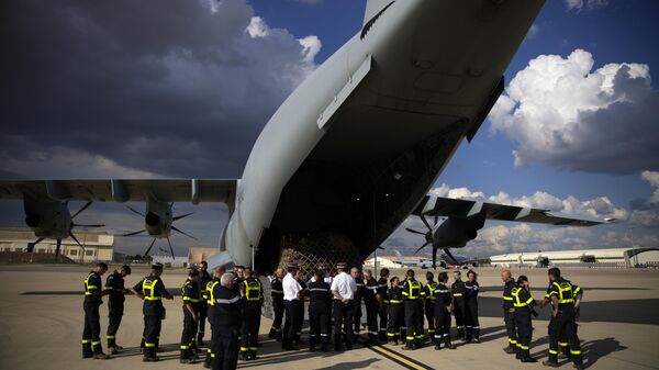 French aid workers wait by a cargo plane loaded with disaster relief for Libya, Wednesday, Sept. 13, 2023 at the Istres military base, southern France. - Sputnik Africa