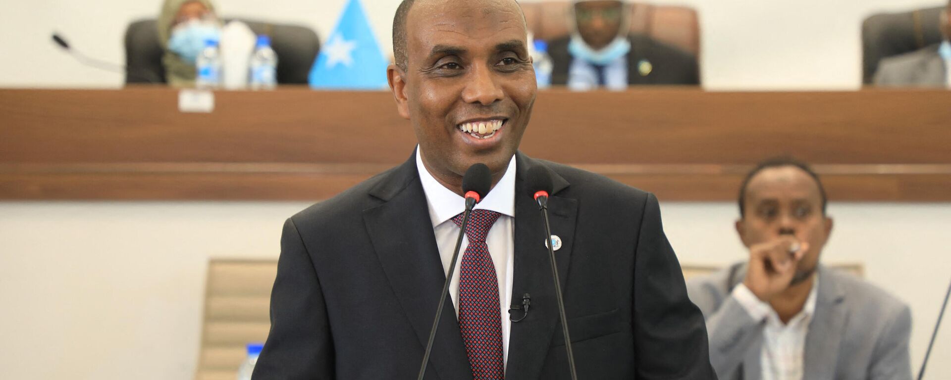 Newly elected Somali Prime Minister Hamza Abdi Barre is seen in Mogadishu on June 25, 2022 while addressing the plenary upon his election. - Sputnik Africa, 1920, 17.09.2023