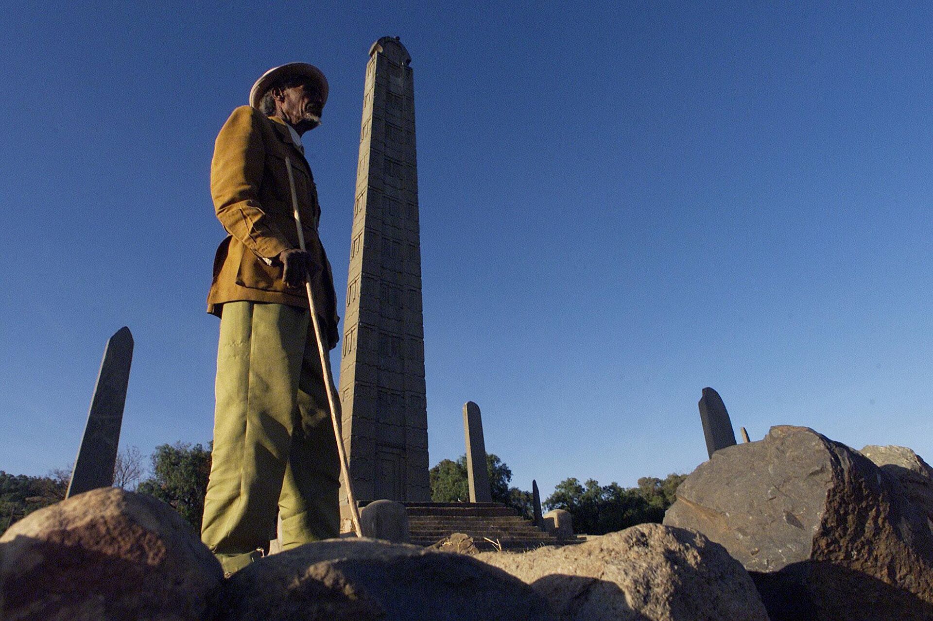 An Ethiopian man known only as Brahane stands in front of the main Obelisk stele in Aksum some 500 kilometers north of the Ethiopian capital Addis Ababa, Jan. 17, 2002.  - Sputnik Africa, 1920, 18.09.2023