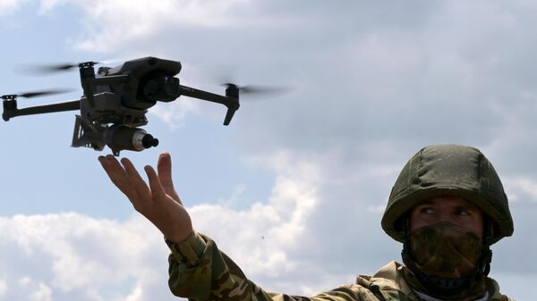 A Russian serviceman is seen using a drone in the special operation zone in Ukraine. File photo - Sputnik Africa