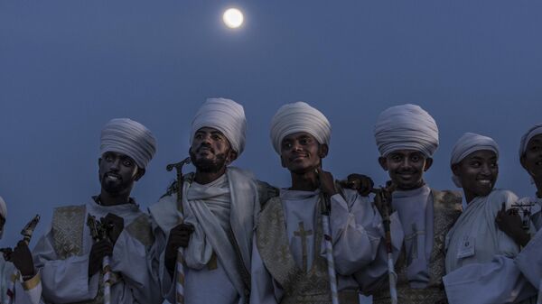 Orthodox deacons observe the celebration of the Ethiopian Orthodox holiday of Meskel in Addis Ababa, Ethiopia - Sputnik Africa