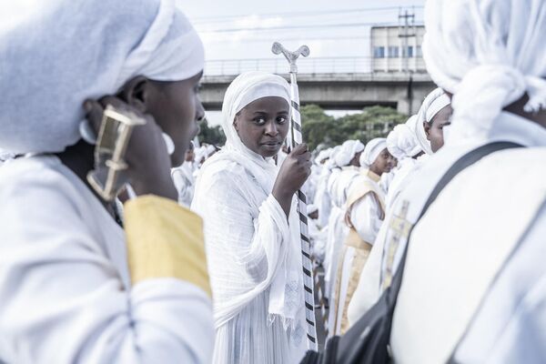 Members of an Orthodox choir wait to perform songs during the celebrations. - Sputnik Africa