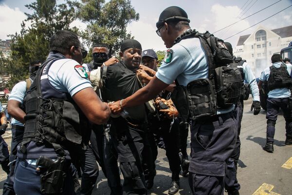 A bodyguard of former President of Madagascar and presidential candidate Marc Ravalomanana is arrested by the Gendarmerie in Antananarivo on October 2, 2023. - Sputnik Africa