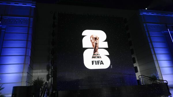 The logo for the 2026 World Cup is shown on a screen outside Griffith Observatory in Los Angeles on Wednesday, May 17, 2023. A unique 2030 World Cup is set to be played in Europe and Africa with the surprising addition of South America in a deal to allow the men’s soccer tournament to start with a 100th birthday party in Uruguay. - Sputnik Africa