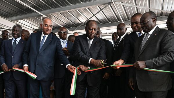 Ivorian President Alassane Ouattara (C), Ivorian Vice-President (R), Ivorian Prime Minister Patrick Achi (2nd L) and Ivorian President of the National Assembly Adama Bictogo (L) cut a ribbon to mark the opening of the International Exhibition of Agriculture and Animal Resources (SARA) at the Abidjan Exhibition Center in Abidjan on September 29, 2023. - Sputnik Africa