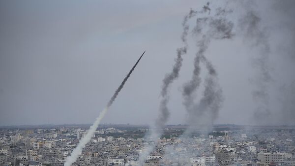 Rockets are launched by Palestinian militants from the Gaza Strip towards Israel, in Gaza, Saturday, Oct. 7, 2023.  - Sputnik Africa