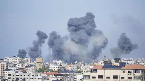 Smoke rises from an explosion caused by an Israeli airstrike in the Gaza Strip, Saturday, Oct. 7, 2023. - Sputnik Africa