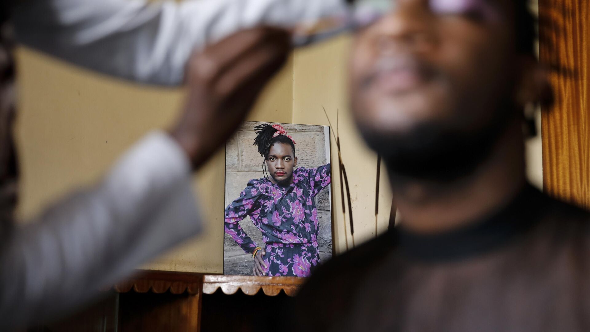 In this photo taken Thursday, June 11, 2020, Raymond Brian, a Ugandan refugee and a nonconforming gender person who also goes by the name of “Mother Nature,” has makeup done in a house at a house that serves as a shelter for LGBT refugees in Nairobi, Kenya. - Sputnik Africa, 1920, 11.10.2023