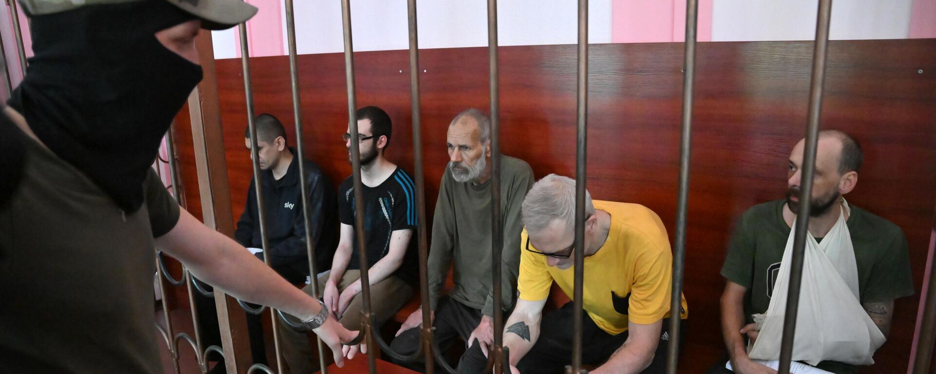 From left, Croatian citizen Vjekoslav Prebeg, British citizens Dylan Healy and John Harding, Swedish citizen Mathias Gustavsson and British citizen Andrew Hill, members of the Azov regiment (designated as a terrorist organization and banned in Russia), charged with mercenary activities, attend a hearing at the Supreme Court in Donetsk, Donetsk People's Republic - Sputnik Africa, 1920, 18.11.2023