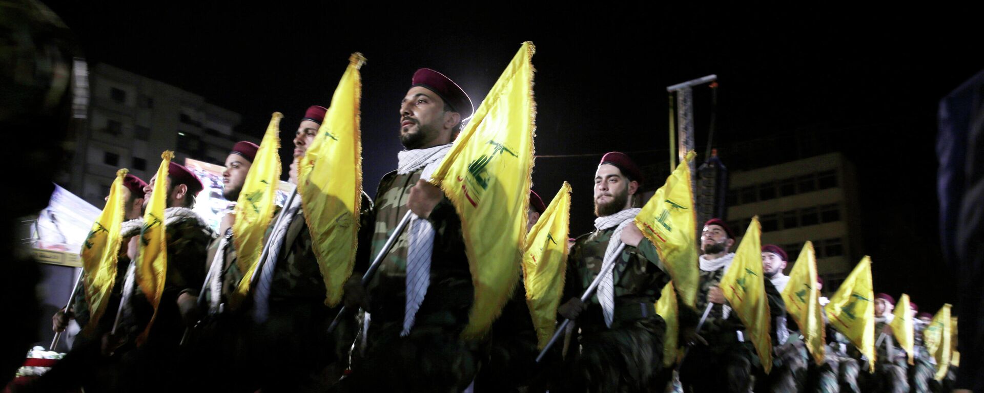 In this May 31, 2019 file photo, Hezbollah fighters march at a rally to mark Jerusalem day or Al-Quds day, in the southern Beirut suburb of Dahiyeh, Lebanon. On Monday, Oct. 18, 2021, Hezbollah leader Sheik Hassan Nasrallah revealed that his militant group has 100,000 trained fighters. - Sputnik Africa, 1920, 12.10.2023