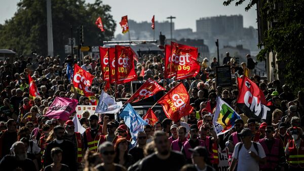 Protestors take part in a rally as part of a nationwide day of demonstrations called by French trade unions to demand wage hikes and gender equality in Lyon, central-eastern France - Sputnik Africa