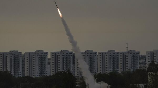  Israel's Iron Dome anti-missile system fires to intercept a rocket launched from the Gaza Strip towards Israel, near Ashkelon, Israel, Thursday, May 11, 2023.  - Sputnik Africa