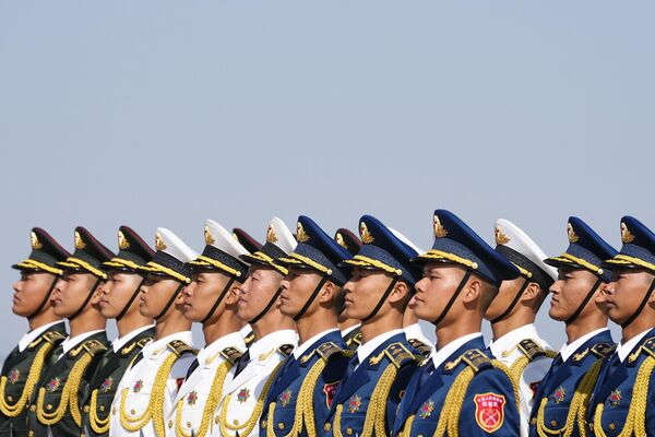 Honour guards wait for the arrival of Congo’s President Denis Sassou Nguesso at Beijing Capital International Airport ahead of the event. - Sputnik Africa