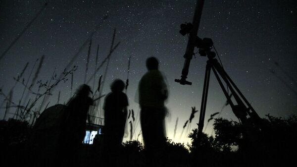 Astronomers observe the night sky for the Perseid meteor shower at an observatory near the village of Avren, east of the Bulgarian capital Sofia, Wednesday, Aug. 12, 2009. - Sputnik Africa