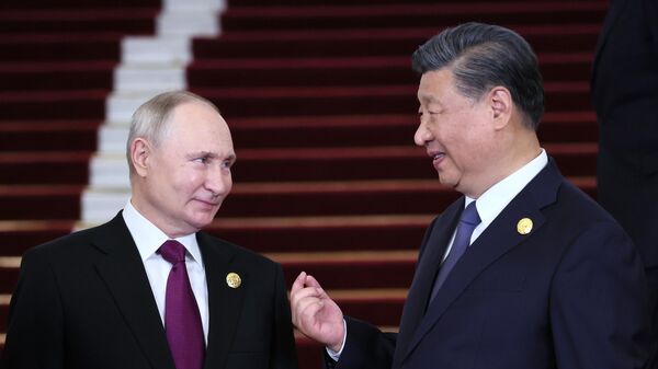 Russian President Vladimir Putin listens to Chinese President Xi Jinping during a welcoming ceremony for heads of delegations participating in the 3rd Belt and Road Forum for International Cooperation, at the Great Hall of the People in Beijing, China, on October 17, 2023. - Sputnik Africa