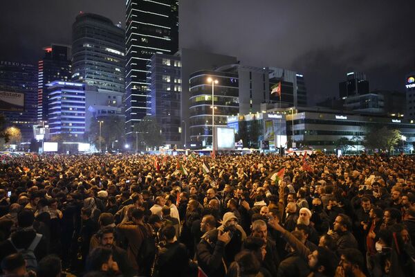 People gather outside the Israeli consulate during a protest to show solidarity with Palestinians, in Istanbul, Turkey, Tuesday, Oct. 17, 2023. A massive blast rocked a Gaza City hospital packed with wounded and other Palestinians seeking shelter Tuesday, killing hundreds of people, the Hamas-run Health Ministry said. Hamas blamed an Israeli airstrike, while the Israeli military said the hospital was hit by a rocket misfired by Palestinian militants.  - Sputnik Africa