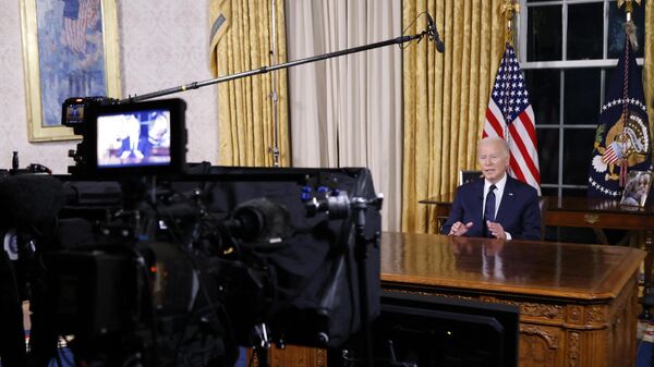US President Joe Biden addresses the nation on the conflict between Israel and Gaza and the conflagration in Ukraine from the Oval Office of the White House in Washington, DC, on October 19, 2023. - Sputnik Africa