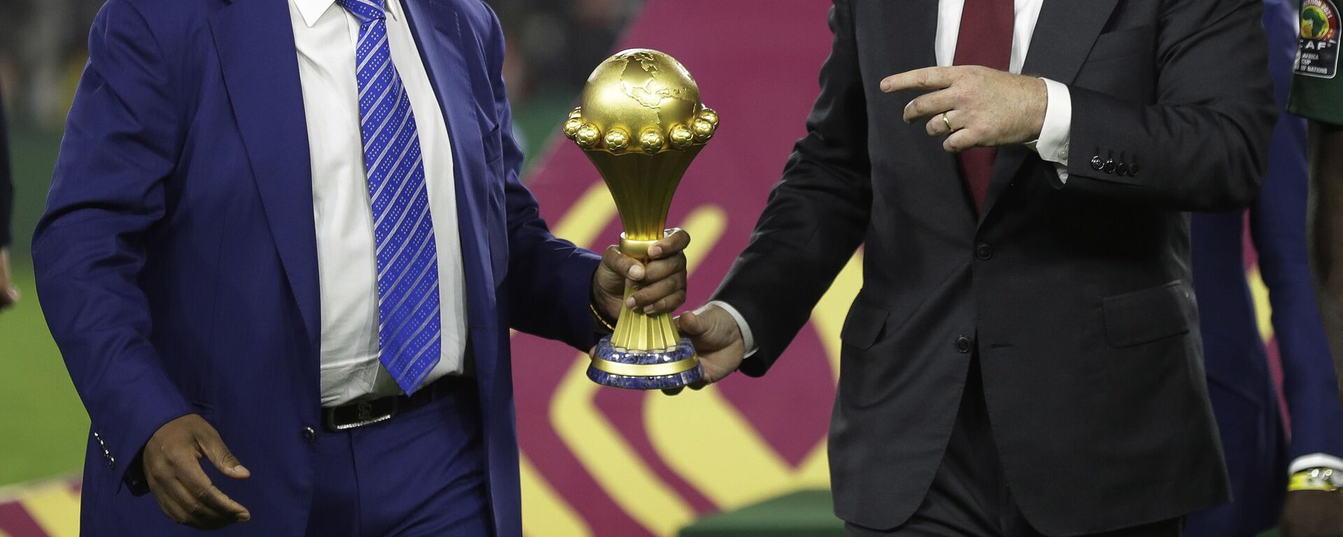 Confederation of African Football President Patrice Motsepe, left, and FIFA President Gianni Infantino hold the African Cup of Nations 2022 trophy after the final soccer match between Senegal and Egypt at the Olembe stadium in Yaounde, Cameroon, Feb. 6, 2022.  - Sputnik Africa, 1920, 21.10.2023