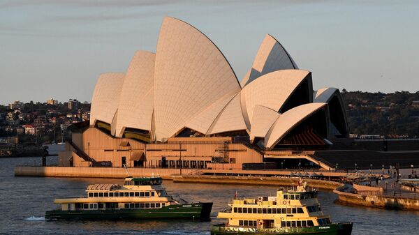 Ferries pass in front of the Opera House in Sydney on August 14, 2021. Australians on October 20, 2023 celebrate the 50th anniversary of the Sydney Opera House, lighting up the sails of a harbourside masterpiece that has become an international icon - Sputnik Africa