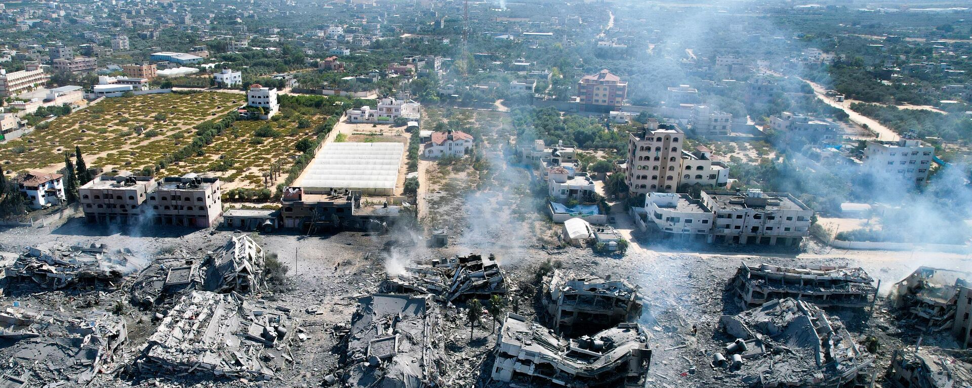 Bâtiments détruits dans la ville d'al-Zahra, au sud de la ville de Gaza, le 8 Octobre (Photo by Belal ALSABBAGH / AFP) - Sputnik Afrique, 1920, 23.10.2023